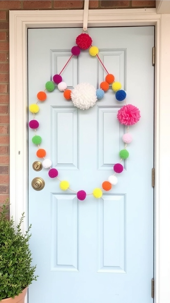 Colorful pom-pom garland hanging on a light blue door