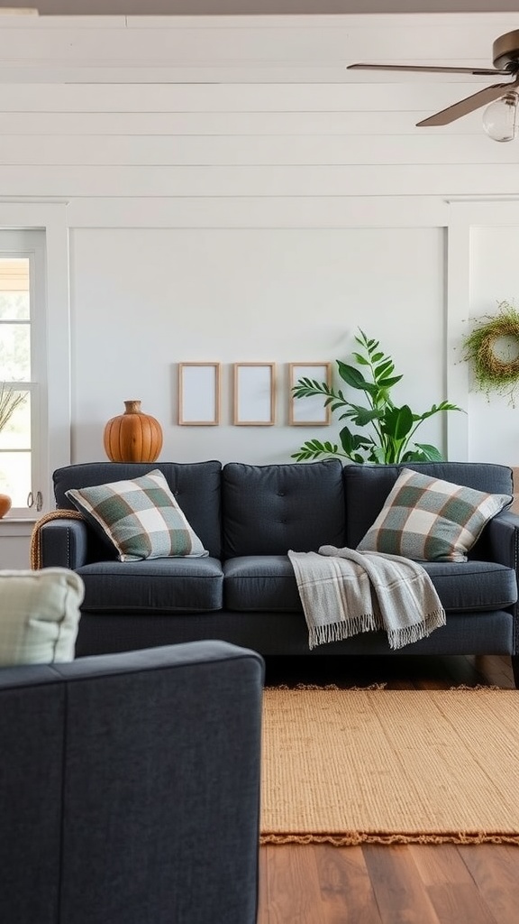 Cozy living room featuring a dark gray couch with plaid pillows, a throw blanket, and rustic decor.